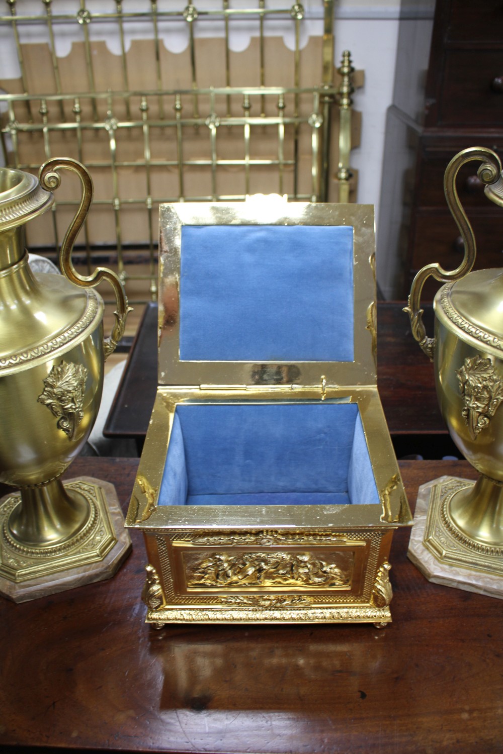 An ornate Italian gilt metal casket, 29cm and a pair of gilt metal vases on onyx plinths, height 49cm